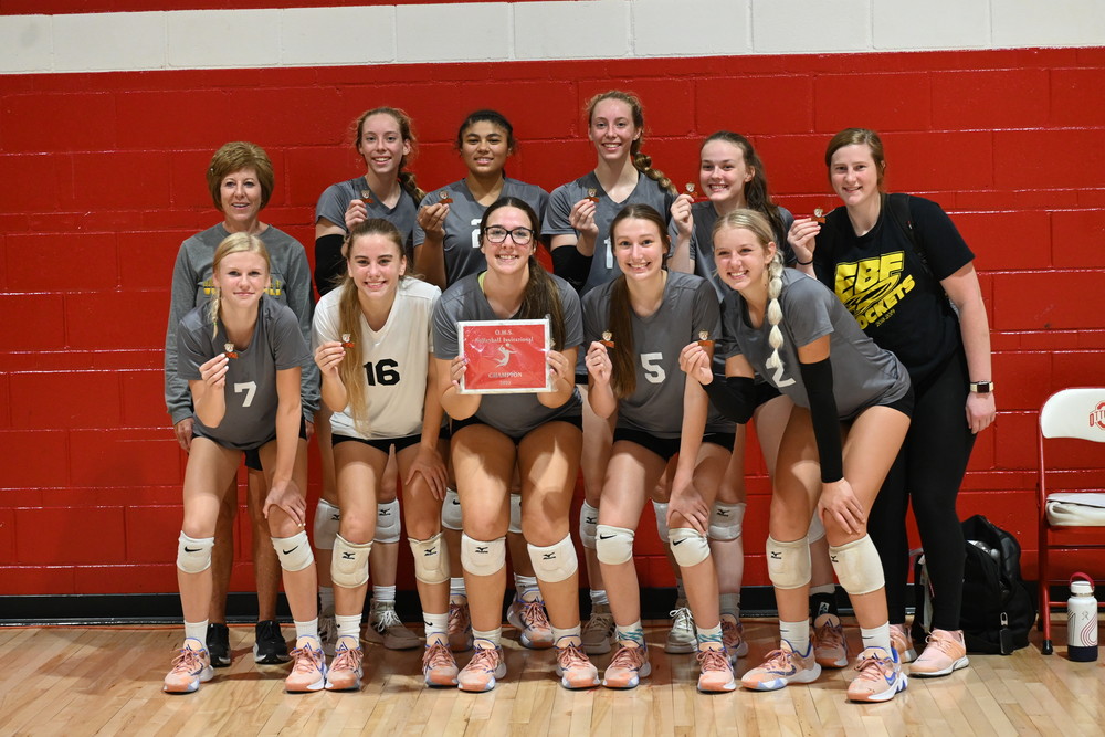 Picture of EBF volleyball team with their awards for winning the Ottumwa Invitational